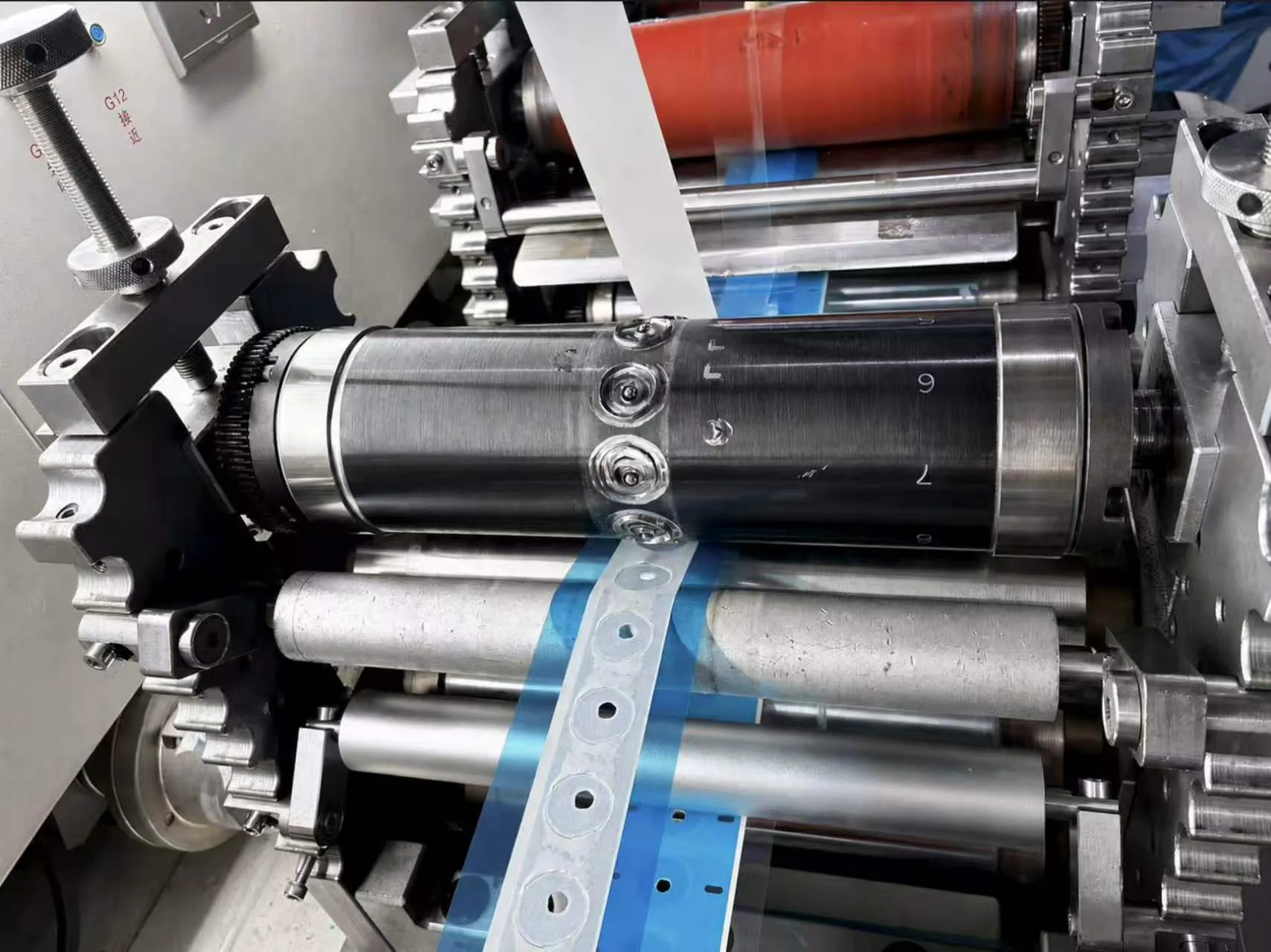 Rotary die cutting tooling converting medical roll materials